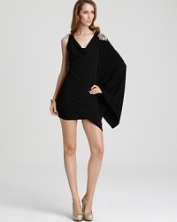 Cut a hypermodern silhouette in this dynamic ABS by Allen Schwartz dress boasting a single voluminous sleeve, with a sparkling beaded shoulder, for a dramatic edge. Cut a hypermodern silhouette in this dynamic ABS by Allen Schwartz dress boasting a single voluminous sleeve, with a sparkling beaded shoulder, for a dramatic edge.