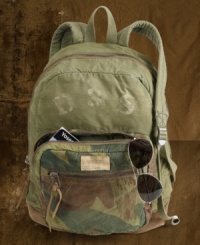 camo-print front and allover paint splatters for a rugged, worn-in vibe.