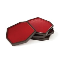 Vivid red lacquer adds a dash of drama to coffee and side tables while protecting against drips.