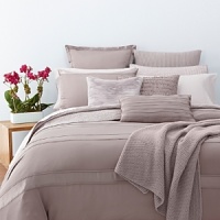 Alternating bands of luxurious matte and shiny silk, trimmed in airy chiffon elevate a simple bedding ensemble. Sheets, pillowcases and bedskirt are simple, soft 410-thread count Egyptian cotton. Alternating bands of luxurious matte and shiny silk, trimmed in airy chiffon elevate a simple bedding ensemble. Sheets, pillowcases and bedskirt are simple, soft 410-thread count Egyptian cotton.
