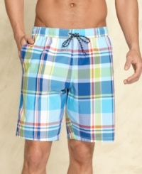 Look sharp in the sea or sand with these Tommy Hilfiger plaid swim trunks. Look sharp in the sea or sand with these Tommy Hilfiger plaid swim trunks.