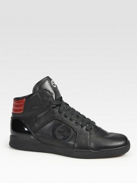 Black leather with red python on heel.Interlocking G detail at sidesPadded back ankleGucci logo embossed rubber soleMade in Italy Black leather with red python on heel.Interlocking G detail at sidesPadded back ankleGucci logo embossed rubber soleMade in Italy
