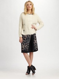 Soft and cozy in a lush blend of alpaca and wool, finished with a distressed drop-stitch pattern.BoatneckLong sleevesPullover styleAbout 22 from shoulder to hem74% alpaca/22% wool/4% nylonDry cleanImported
