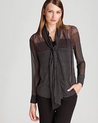 With a sheer silhouette and delicate neck tie, this Bloomingdale's exclusive Gerard Darel blouse embraces a romantic sense of style with a grand flourish. With a sheer silhouette and delicate neck tie, this Bloomingdale's exclusive Gerard Darel blouse embraces a romantic sense of style with a grand flourish.