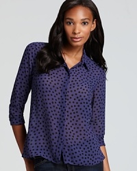 See, spot, style: this BCBGeneration shirt is polka dot perfection, with a classic collar and rounded hem fit for work wear. See, spot, style: this BCBGeneration shirt is polka dot perfection, with a classic collar and rounded hem fit for work wear.