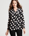 In luxe silk, this Equipment blouse, with its lovely heart print, infuses a sense of artistic beauty into your every day.