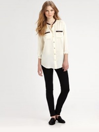 Retro contrast trim, collarless neckline and a lengthy contoured hem define this lustrous silk basic. RoundneckButton frontFront patch pocketsLong sleeves with buttoned cuffsShirttail hem hits below hipsSilkDry cleanImportedModel shown is 5'10 (177cm) wearing US size Small. Retro contrast trim, collarless neckline and a lengthy contoured hem define this lustrous silk basic. RoundneckButton frontFront patch pocketsLong sleeves with buttoned cuffsShirttail hem hits below hipsSilkDry cleanImportedModel shown is 5'10 (177cm) wearing US size Small.