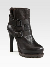 Daring silhouette of pebbled leather with a fierce heel, adjustable buckle straps and sawtooth rubber sole. Self-covered heel, 5 (125mm)Rubber platform, ¾ (20mm)Compares to a 4¼ heel (110mm)Leather upperAdjustable buckle strapsLeather liningRubber sawtooth solePadded insoleImported Daring silhouette of pebbled leather with a fierce heel, adjustable buckle straps and sawtooth rubber sole. Self-covered heel, 5 (125mm)Rubber platform, ¾ (20mm)Compares to a 4¼ heel (110mm)Leather upperAdjustable buckle strapsLeather liningRubber sawtooth solePadded insoleImported