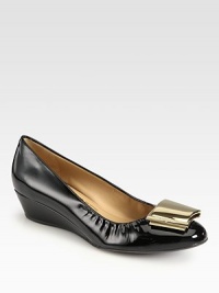 Fashionable yet practical leather staple with a demi-wedge and logo-detailed goldtone accent. Self-covered wedge, 1¼ (30mm)Leather upperLeather liningRubber solePadded insoleMade in Italy Fashionable yet practical leather staple with a demi-wedge and logo-detailed goldtone accent. Self-covered wedge, 1¼ (30mm)Leather upperLeather liningRubber solePadded insoleMade in Italy