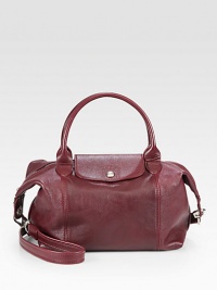 A classic iconic style, now in luxurious leather with a versatile strap.Double top handles, 4¼ dropDetachable shoulder strap, 19½ dropTop zip closure with snap flapOne inside zip pocketTwo inside open pocketsFully lined9¾W X 9H X 6¼DImported A classic iconic style, now in luxurious leather with a versatile strap.Double top handles, 4¼ dropDetachable shoulder strap, 19½ dropTop zip closure with snap flapOne inside zip pocketTwo inside open pocketsFully lined9¾W X 9H X 6¼DImported