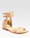 A minimalist ankle strap silhouette rendered in ultra-smooth leather for a simple yet chic look. Leather upperAdjustable ankle strapsLeather lining and solePadded insoleImported