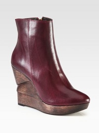 A tall sculpted wooden wedge revitalizes this classic leather staple. Wooden wedge, 4½ (115mm)Wooden platform, 1 (25mm)Compares to a 3½ heel (90mm)Leather upperSide zipLeather liningRubber solePadded insoleImported A tall sculpted wooden wedge revitalizes this classic leather staple. Wooden wedge, 4½ (115mm)Wooden platform, 1 (25mm)Compares to a 3½ heel (90mm)Leather upperSide zipLeather liningRubber solePadded insoleImported