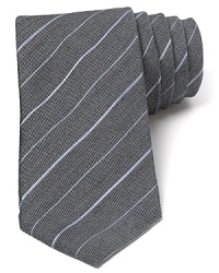 The modern skinny width of this handsome tie complements the classic stripe pattern for a fine accent to your wardrobe. The modern skinny width of this handsome tie complements the classic stripe pattern for a fine accent to your wardrobe.
