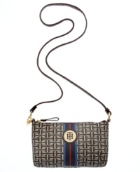 Live la vida logo with this signature print purse from Tommy Hilfiger. The compact crossbody design it adorned with golden hardware, monogram plaque and preppy center stripe, for an undecidedly uptown look. Live la vida logo with this signature print purse from Tommy Hilfiger. The compact crossbody design it adorned with golden hardware, monogram plaque and preppy center stripe, for an undecidedly uptown look.