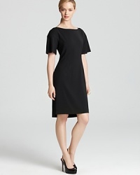 Exude polished perfect in this T Tahari dress boasting precise tailoring and a clean-cut finish. A ribbon belt lends feminine dimension to the structured style.