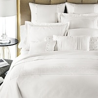 The signature Charisma dot in white cotton, with cross-stitch embroidery inset. The signature Charisma dot in white cotton, with cross-stitch embroidery inset.