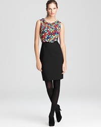 A retro-inspired print lends vintage inspiration to a silk kate spade dress, featuring a contrast A-line skirt cinched with a patent skinny belt for a flattering, feminine silhouette. A retro-inspired print lends vintage inspiration to a silk kate spade dress, featuring a contrast A-line skirt cinched with a patent skinny belt for a flattering, feminine silhouette.