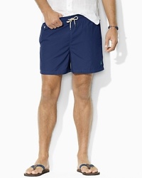 Rendered in quick-drying nylon, the classic-fitting Traveler swim short features a bold solid hue on the outside and a preppy madras print on the inside.