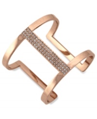 Airy elegance. Vince Camuto's cut-out cuff bracelet is crafted from rose gold-tone mixed metal with glass crystal accents adding a lustrous touch to the eclectic piece. Approximate diameter: 3-1/2 inches.