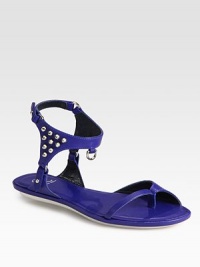 Smooth leather gladiator with rocker-chic studs and an adjustable ankle strap. Leather upperLeather liningRubber solePadded insoleImported Smooth leather gladiator with rocker-chic studs and an adjustable ankle strap. Leather upperLeather liningRubber solePadded insoleImported