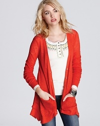 Smart style, smart cardi: this cozy knit Free People sweater is in the know when it comes to chic layering. Smart style, smart cardi: this cozy knit Free People sweater is in the know when it comes to chic layering.