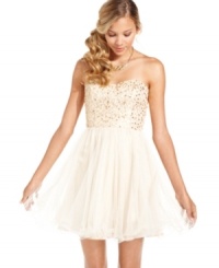 Featuring a shimmery sequin bodice, a fairytale corset-laced back, and a flirty tulle skirt, this strapless dress by Speechless achieves a fresh ready-to-party look! Featuring a shimmery sequin bodice, a fairytale corset-laced back, and a flirty tulle skirt, this strapless dress by Speechless achieves a fresh ready-to-party look!