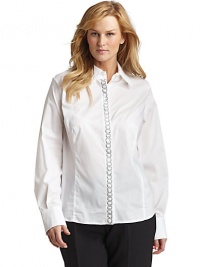 THE LOOKPoint collarSparkly beaded chain design accents the placketButton frontLong sleeves with button cuffsShirttail hemTHE FITAbout 27 from shoulder to hemTHE MATERIAL68% cotton/30% nylon/2% elastaneCARE & ORIGINHand washImported THE LOOKPoint collarSparkly beaded chain design accents the placketButton frontLong sleeves with button cuffsShirttail hemTHE FITAbout 27 from shoulder to hemTHE MATERIAL68% cotton/30% nylon/2% elastaneCARE & ORIGINHand washImported
