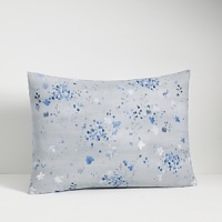 Freshly painted flowers in tones of blue fall on a textured ground. Duvet has a hidden button closure. Duvets and shams are self reversing. Freshly painted flowers in tones of blue fall on a textured ground. Duvet has a hidden button closure. Duvets and shams are self reversing.