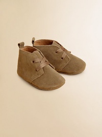 Adorable baby booties crafted in ultra-plush suede in a lace-up silhouette.Ribbon tieSuede upperLeather liningLeather solePadded insoleImported Adorable baby booties crafted in ultra-plush suede in a lace-up silhouette.Ribbon tieSuede upperLeather liningLeather solePadded insoleImported