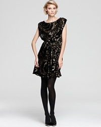 Metallic luster in a flowy blouson style enrich this shiny-chic Alice + Olivia dress and take the guesswork out of dressing for all of your festive occasions. Metallic luster in a flowy blouson style enrich this shiny-chic Alice + Olivia dress and take the guesswork out of dressing for all of your festive occasions.