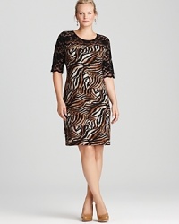 Elegant lace meets lively exotics for a statement Karen Kane Plus dress sure to stand out. Elegant lace meets lively exotics for a statement Karen Kane Plus dress sure to stand out.