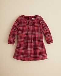 Trading on the classic charm at which Burberry excels, this adorable check dress is adorned simply with gathered pleats at the chest and a full-button back closure. Trading on the classic charm at which Burberry excels, this adorable check dress is adorned simply with gathered pleats at the chest and a full-button back closure.