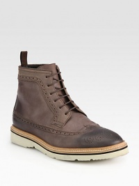Wingtip lace-up casual boot exudes polished perfection with traditional perforations and a comfortable, contrast sole for a relaxed finish.Leather upperLeather liningMicro soleImported Wingtip lace-up casual boot exudes polished perfection with traditional perforations and a comfortable, contrast sole for a relaxed finish.Leather upperLeather liningMicro soleImported