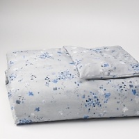 Freshly painted flowers in tones of blue fall on a textured ground. Duvet has a hidden button closure. Duvets and shams are self reversing. Freshly painted flowers in tones of blue fall on a textured ground. Duvet has a hidden button closure. Duvets and shams are self reversing.
