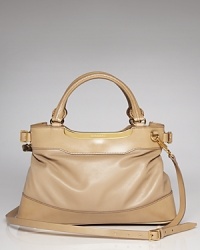 True to form, this Burberry satchel works a classic vibe in rich leather with a versatile design that is perfect on the arm or across the body. True to form, this Burberry satchel works a classic vibe in rich leather with a versatile design that is perfect on the arm or across the body.