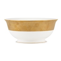 A scintillating band adorns the exterior of this alluring serving bowl, sprinkled with gold dust for dramatic effect, and crafted with a classic shape that suits all your formal presentations. A scintillating band adorns the exterior of this alluring serving bowl, sprinkled with gold dust for dramatic effect, and crafted with a classic shape that suits all your formal presentations.