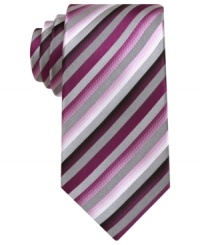 In a warm palette, this striped skinny tie from Alfani brightens up the concrete jungle. In a warm palette, this striped skinny tie from Alfani brightens up the concrete jungle.