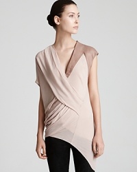Asymmetric details and supple leather meet for standout modernity on this sheer Helmut Lang top, a must have for the fashion-forward dresser. Asymmetric details and supple leather meet for standout modernity on this sheer Helmut Lang top, a must have for the fashion-forward dresser.