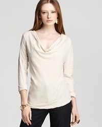 Featuring an elegant cowlneck in the front and a crochet embellishment in the back, this XCVI top doubles up on chic details. Featuring an elegant cowlneck in the front and a crochet embellishment in the back, this XCVI top doubles up on chic details.