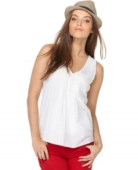 Brighten up for summer in Calvin Klein Jeans' must-have sleeveless tank top, made in an ultralight cotton fabric blend. Brighten up for summer in Calvin Klein Jeans' must-have sleeveless tank top, made in an ultralight cotton fabric blend.