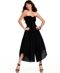 Cropped palazzo pants offset a fitted, bow-adorned top on a jumpsuit from American Rag that ups the ante on totally fun day style! Cropped palazzo pants offset a fitted, bow-adorned top on a jumpsuit from American Rag that ups the ante on totally fun day style!