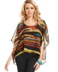 Painted in serene, Sahara-inspired colors -- and sporting a chic, asymmetrical design -- this caftan from Jessica Simpson is an easy, breezy style for balmy days. Painted in serene, Sahara-inspired colors -- and sporting a chic, asymmetrical design -- this caftan from Jessica Simpson is an easy, breezy style for balmy days.