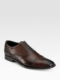 Traditional captoe lace-up is expertly crafted in Italy from smooth calfskin leather with perforated detail and a sturdy, yet supportive leather sole.Leather upperLeather liningPadded insoleLeather soleMade in Italy Traditional captoe lace-up is expertly crafted in Italy from smooth calfskin leather with perforated detail and a sturdy, yet supportive leather sole.Leather upperLeather liningPadded insoleLeather soleMade in Italy