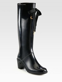 Metal-tip grosgrain ribbon and an elevated heel add feminine style to this rubber spring staple. Rubber heel, 2½ (65mm)Shaft, 14¾Leg circumference, 14¾Rubber upper with grosgrain ribbonLeather liningRubber trek solePadded insoleImportedOUR FIT MODEL RECOMMENDS ordering true whole size; ½ sizes should order the next whole size up. Metal-tip grosgrain ribbon and an elevated heel add feminine style to this rubber spring staple. Rubber heel, 2½ (65mm)Shaft, 14¾Leg circumference, 14¾Rubber upper with grosgrain ribbonLeather liningRubber trek solePadded insoleImportedOUR FIT MODEL RECOMMENDS ordering true whole size; ½ sizes should order the next whole size up.