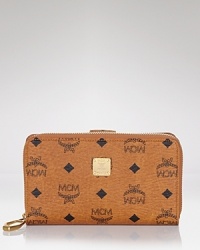 No purse is complete without the right wallet, and MCM's logo-splashed style is an edgy-glam choice. Cleverly designed with multiple pockets, it's an effortless essential. No purse is complete without the right wallet, and MCM's logo-splashed style is an edgy-glam choice. Cleverly designed with multiple pockets, it's an effortless essential.