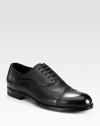 Handsome leather oxford with impeccable hand stitching and painting, exuding expert Italian craftsmanship and attention to detail.Leather upperLeather liningPadded insoleRubber soleMade in Italy