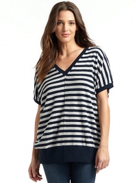 THE LOOKRibbed double v neckDolman short sleevesRaised center and shoulder seamsRibbed hemBack buttonsTHE FITAbout 29 from shoulder to hemTHE MATERIALCashmereCARE & ORIGINHand wash or dry cleanImportedModel shown is 5'8 (173cm) wearing US size Small. THE LOOKRibbed double v neckDolman short sleevesRaised center and shoulder seamsRibbed hemBack buttonsTHE FITAbout 29 from shoulder to hemTHE MATERIALCashmereCARE & ORIGINHand wash or dry cleanImportedModel shown is 5'8 (173cm) wearing US size Small.