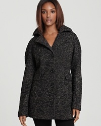 A transweight classic you may wear across multiple seasons, this Calvin Klein pea coat is traditionally structured in soft wool tweed with a notch collar and a detachable hood for added versatility.