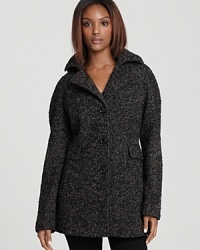 A transweight classic you may wear across multiple seasons, this Calvin Klein pea coat is traditionally structured in soft wool tweed with a notch collar and a detachable hood for added versatility. A transweight classic you may wear across multiple seasons, this Calvin Klein pea coat is traditionally structured in soft wool tweed with a notch collar and a detachable hood for added versatility.