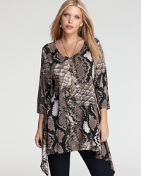 Embark on an exotic quest in a reptilian-print Karen Kane Plus tunic, finished with an edgy handkerchief hem for a riveting sense of style adventure. Embark on an exotic quest in a reptilian-print Karen Kane Plus tunic, finished with an edgy handkerchief hem for a riveting sense of style adventure.